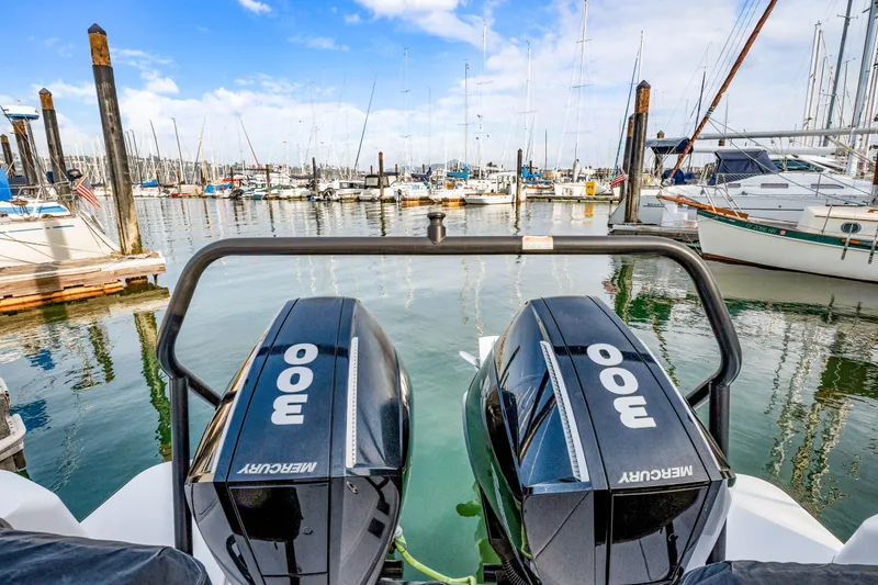 Slide: The Image of 2021 Axopar 37 XC Cross Cabin with twin Mercury 300 engines docked at marina. - 22