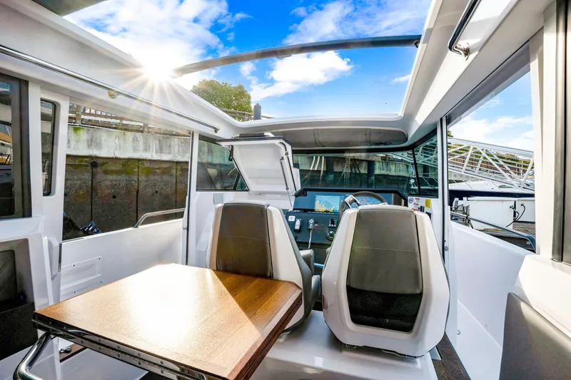Slide: The Image of 2021 Axopar 37 XC Cross Cabin interior with sunroof and modern seating. - 36