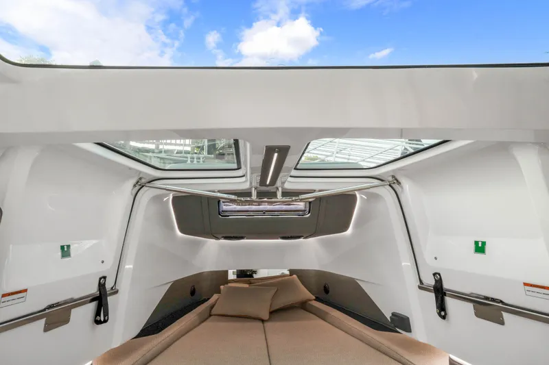 Slide: The Image of 2021 Axopar 37 XC Cross Cabin interior with skylights and comfortable seating. - 39