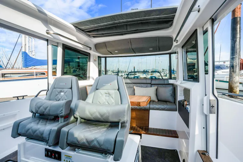 Slide: The Image of 2021 Axopar 37 XC Cross Cabin interior with plush seating and modern design. - 43