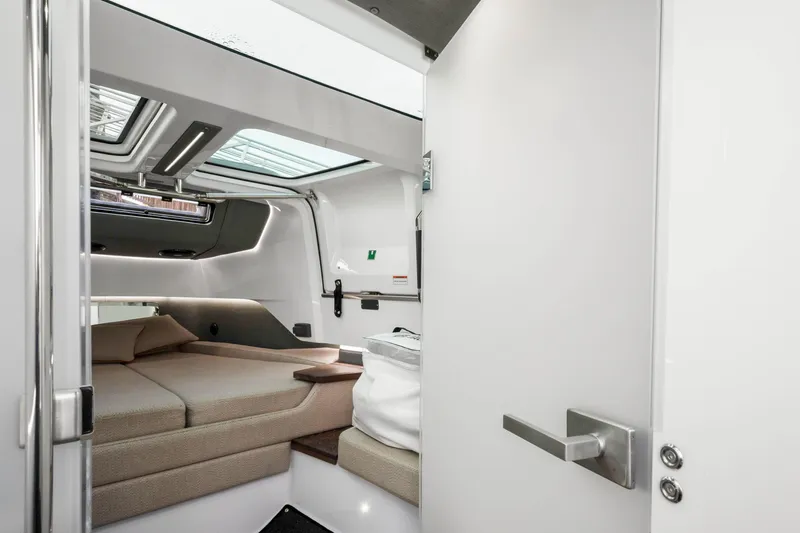 Slide: The Image of 2021 Axopar 37 XC Cross Cabin interior with modern design and comfortable seating. - 47