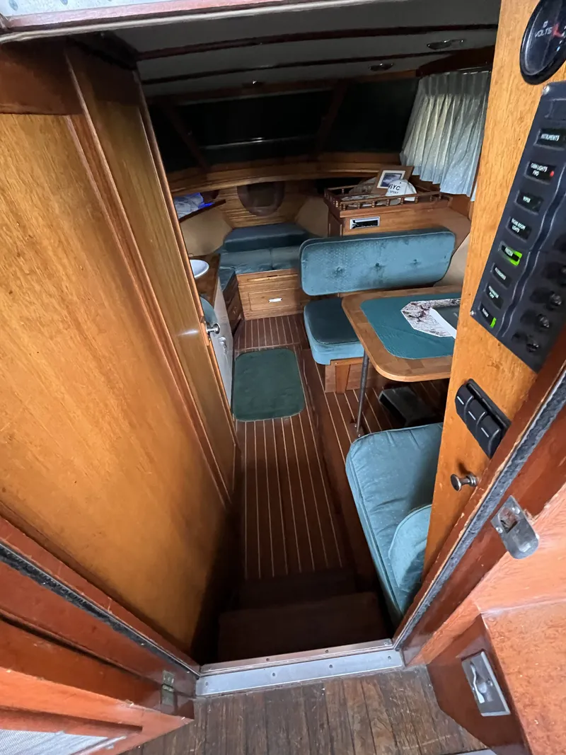 Slide: The Image of Interior of a 1959 Owens Cabin with wooden furnishings. - 16