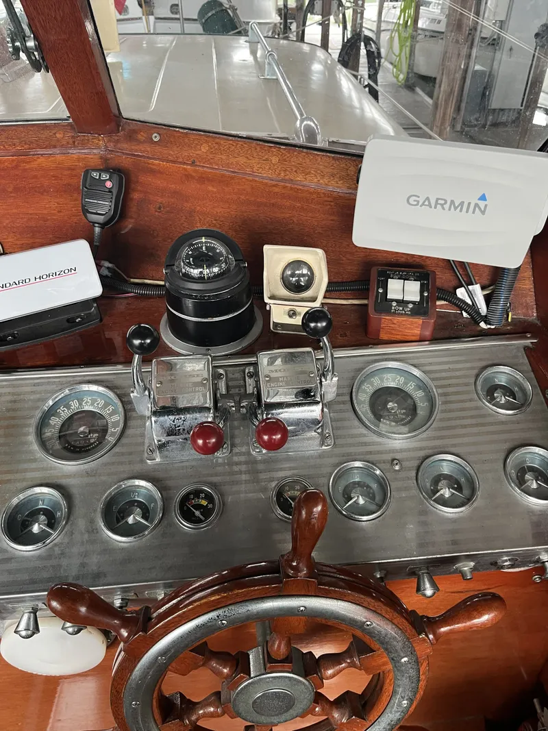 Slide: The Image of Dashboard of a 1959 Owens Cabin boat with Garmin device. - 17