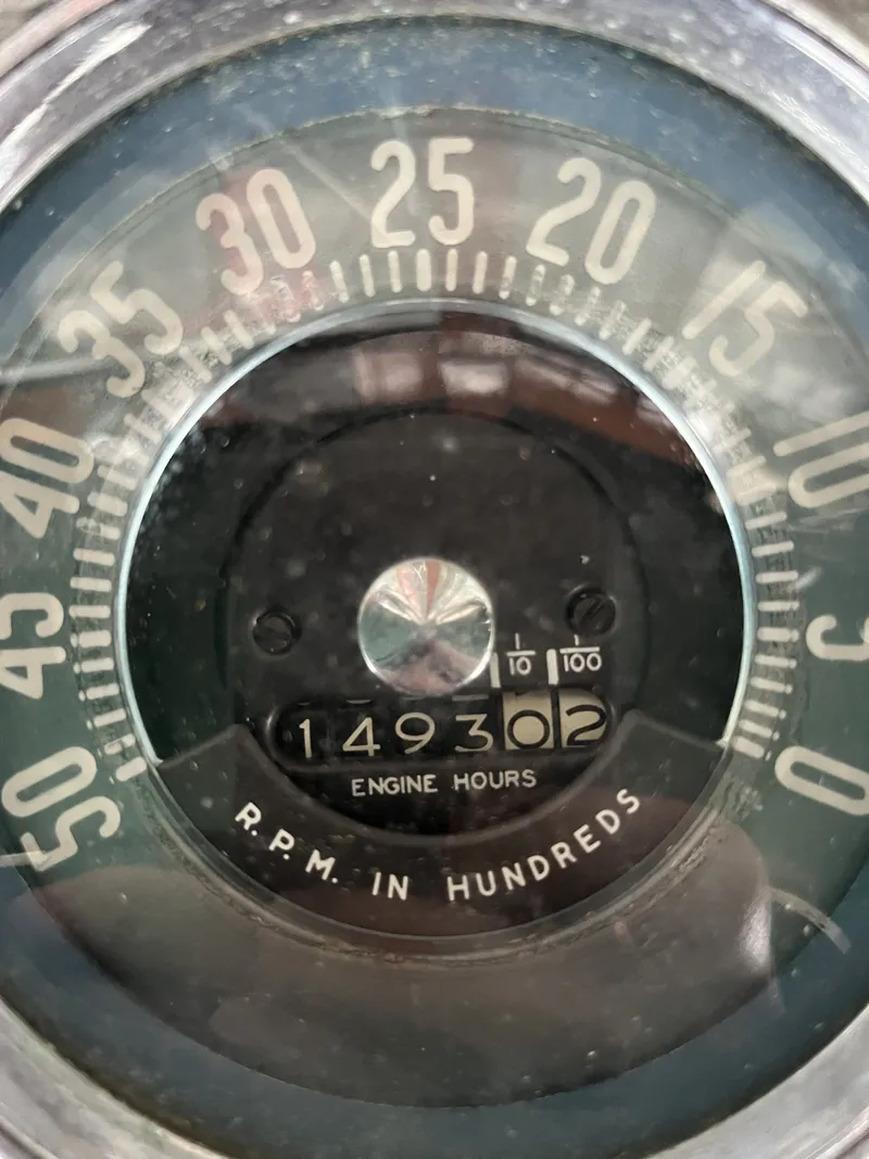 Slide: The Image of 1959 Owens Cabin tachometer showing 1493 engine hours. - 18