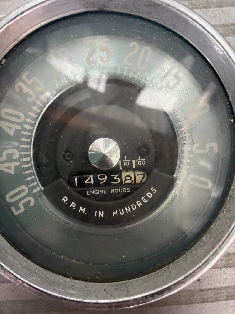 Slide: The Image of 1959 Owens Cabin tachometer showing 1493.87 engine hours. - 19