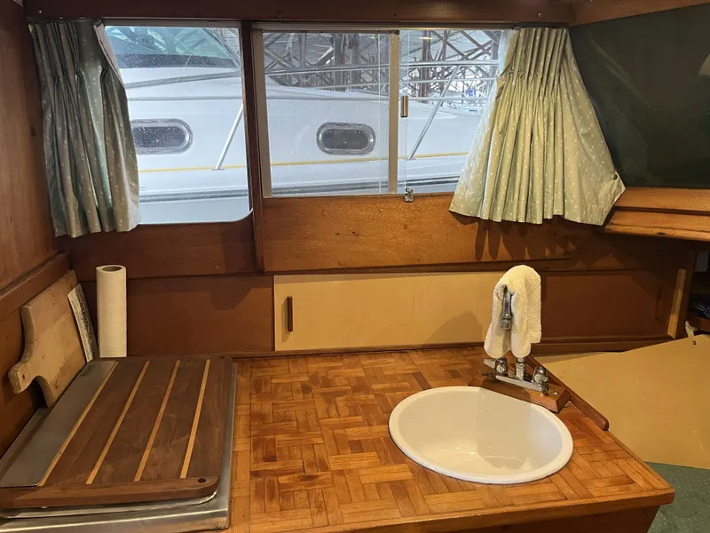 Slide: The Image of Interior of a 1959 Owens Cabin with wooden countertop and sink. - 26