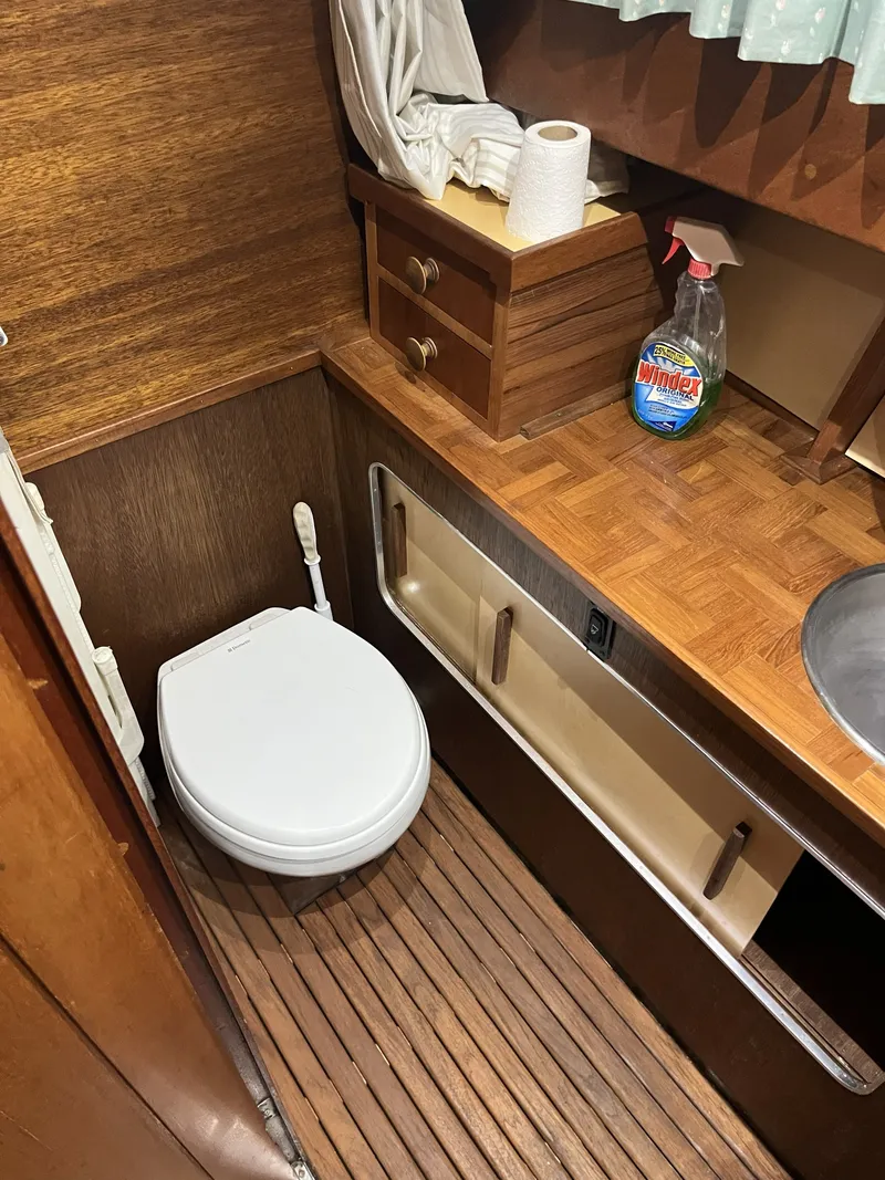 Slide: The Image of 1959 Owens Cabin bathroom with wooden interior. - 27