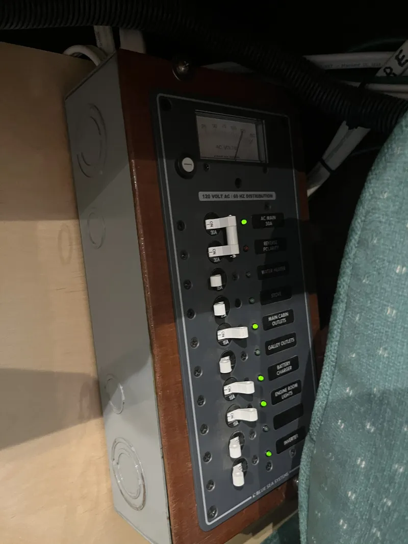 Slide: The Image of 1959 Owens Cabin control panel with toggle switches and indicators. - 28