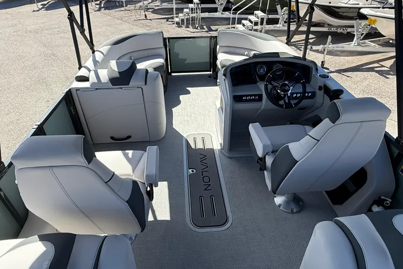 Slide: The Image of Luxurious interior of 2026 Avalon 2385 LSZ Quad Lounger Tri Toon boat, featuring plush seating. - 21
