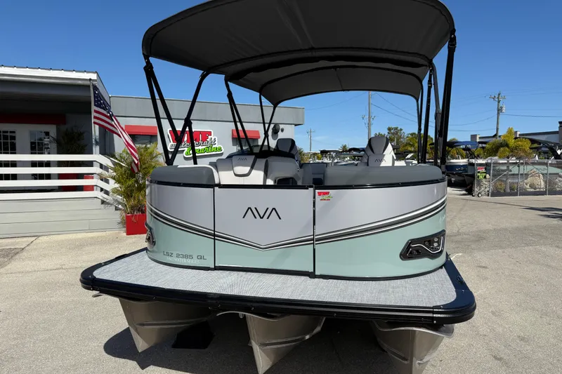 Slide: The Image of 2026 Avalon 2385 LSZ Quad Lounger Tri Toon boat displayed outdoors. - 3