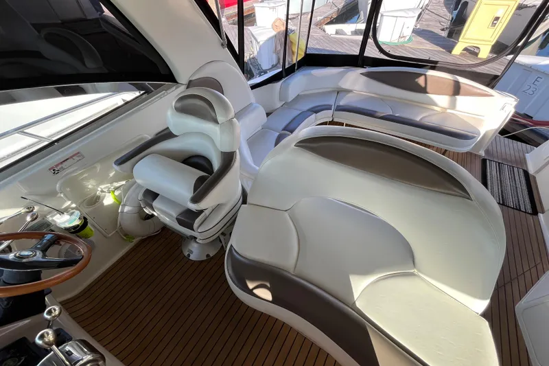 Slide: The Image of Luxurious interior of 2003 Searay 380 yacht with plush seating and wooden flooring. - 17