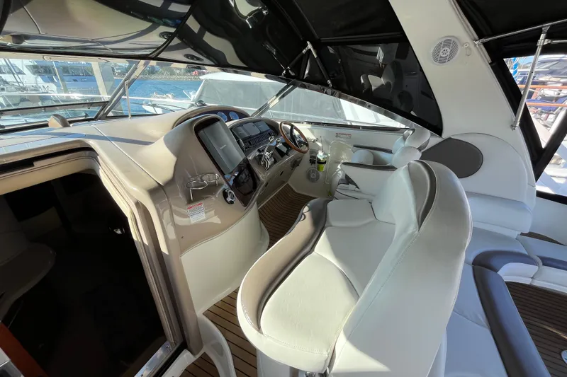 Slide: The Image of Interior view of 2003 Searay 380 yacht cockpit with modern controls and seating. - 18