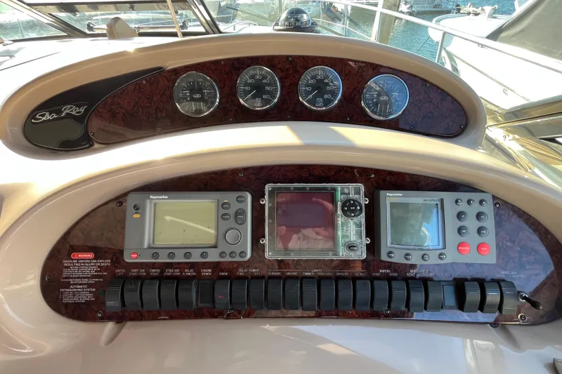 Slide: The Image of Control panel of a 2003 Searay 380 boat with navigation instruments. - 20