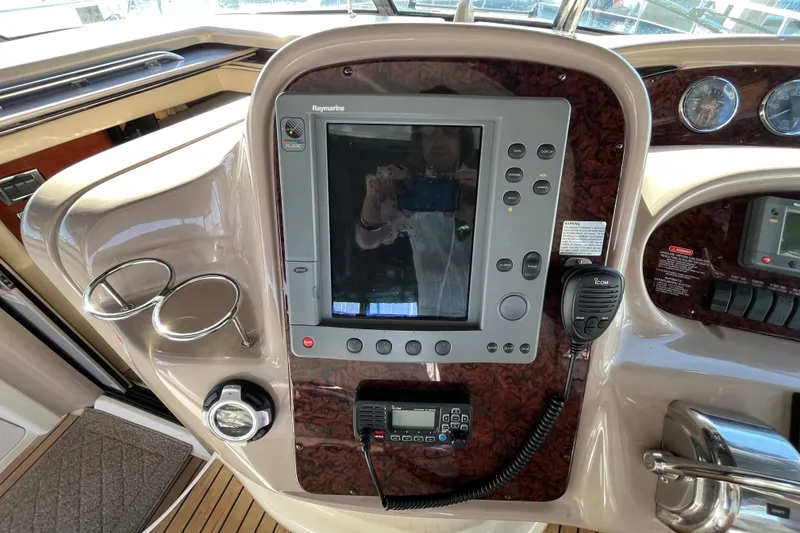 Slide: The Image of Control panel of a 2003 Searay 380 boat with navigation equipment. - 21