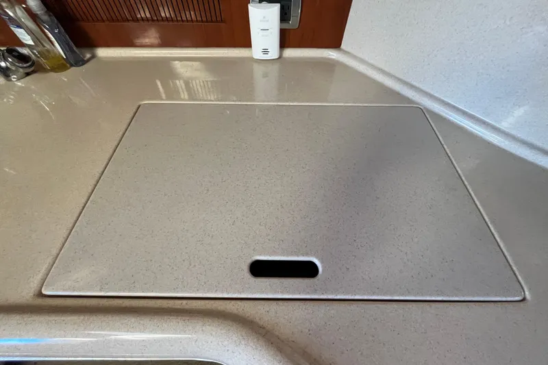 Slide: The Image of 2003 Searay 380 yacht kitchen countertop with integrated stove cover. - 26