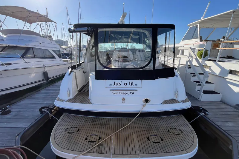 Slide: The Image of 2003 Searay 380 boat docked in San Diego marina, rear view. - 3