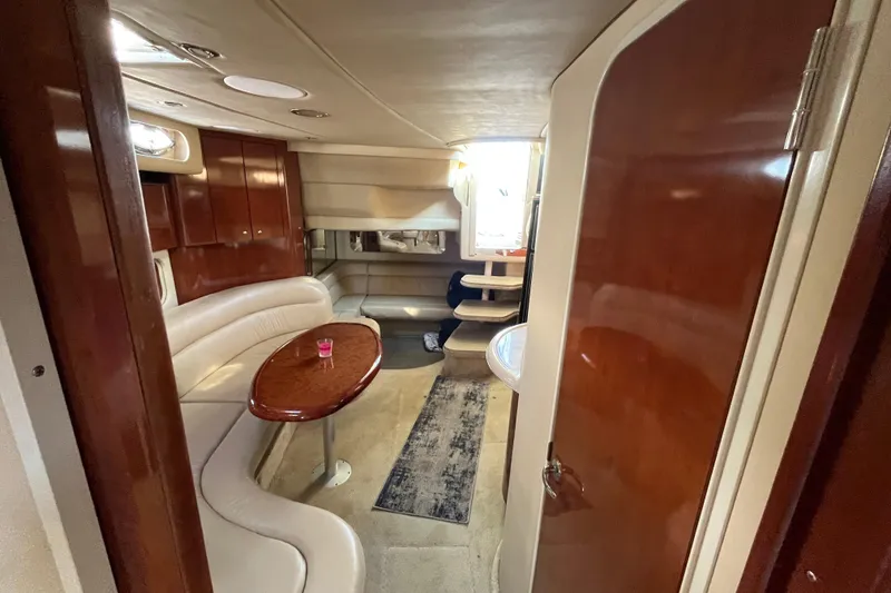 Slide: The Image of Luxurious interior of 2003 Searay 380 yacht with elegant wood finishes and cozy seating. - 32