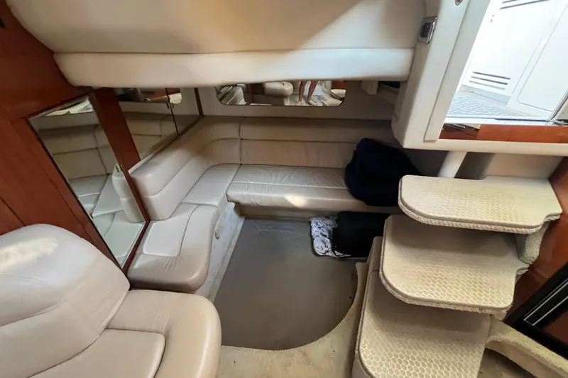 Slide: The Image of Interior of 2003 Searay 380 yacht with beige seating and carpeted steps. - 37
