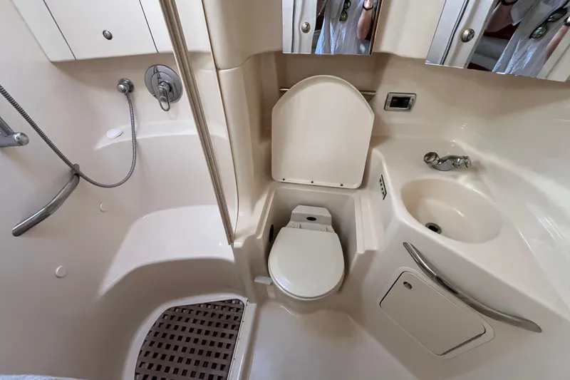 Slide: The Image of 2003 Searay 380 yacht bathroom with shower, toilet, and sink. - 39