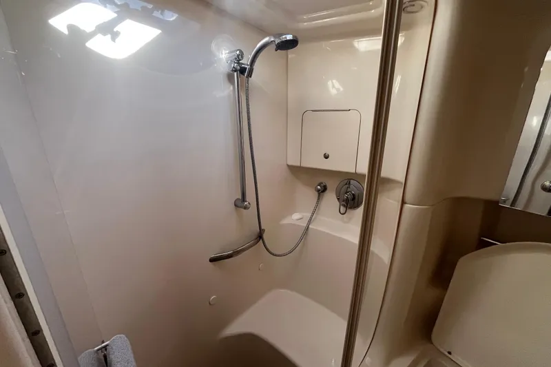 Slide: The Image of 2003 Searay 380 yacht bathroom with shower, featuring sleek design and modern fixtures. - 40