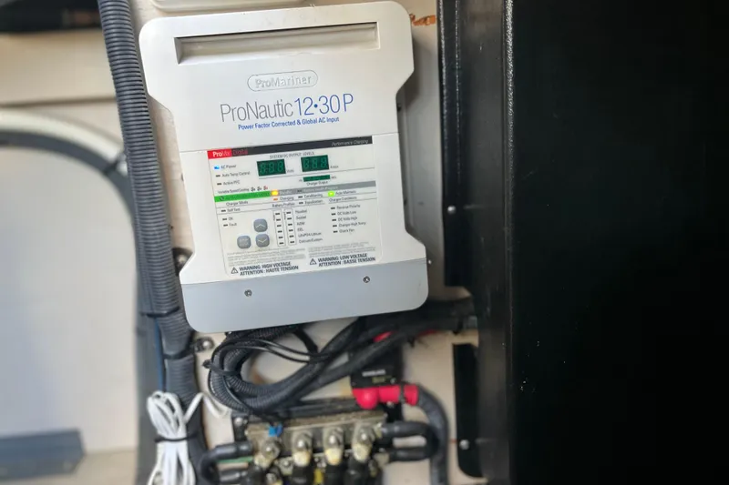 Slide: The Image of ProNautic 12:30P charger in 2003 Searay 380 boat, showing control panel and wiring. - 44