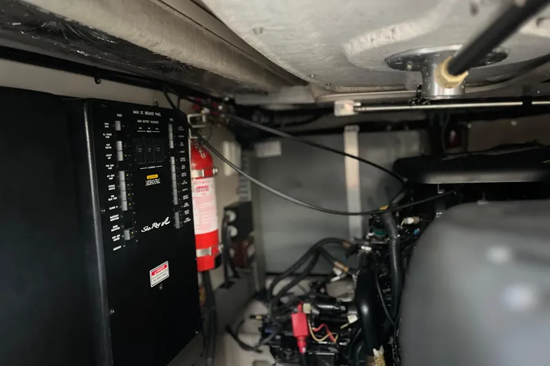 Slide: The Image of Engine room of a 2003 Searay 380 boat with control panel and fire extinguisher. - 45