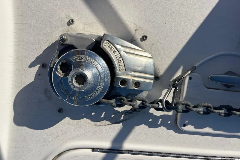 Slide: The Image of Anchor windlass on 2003 Searay 380 boat deck with chain. - 8
