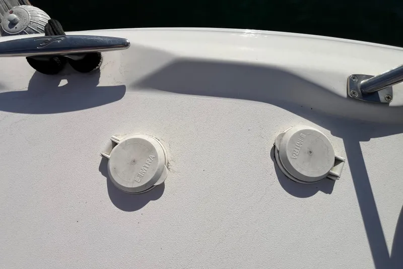 Slide: The Image of Deck of 2003 Searay 380 boat with cleat and two deck fittings. - 9