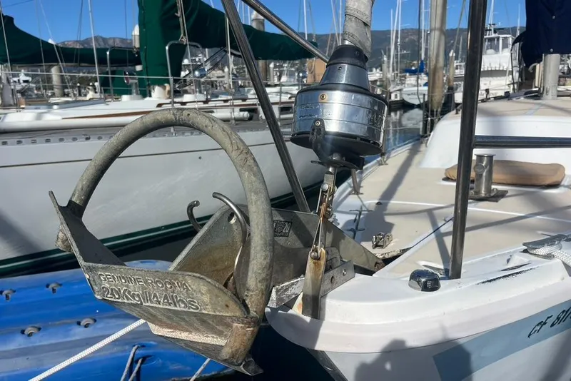 Slide: The Image of 1978 CAL 34 sailboat with anchor and marina background. - 5