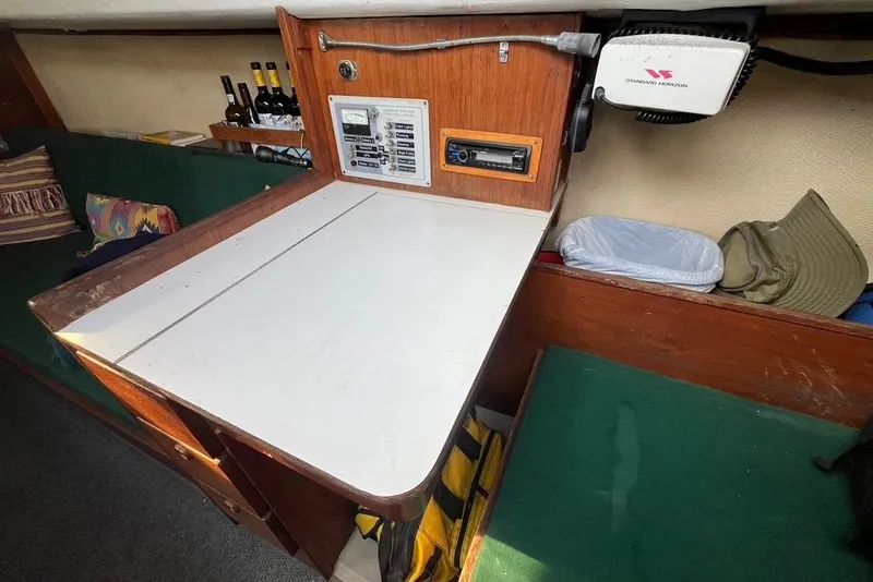 Slide: The Image of 1978 CAL 34 yacht interior with navigation station and seating area. - 8