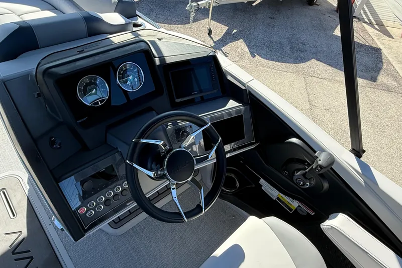 Slide: The Image of Steering console of 2026 Avalon 2385 Catalina Quad Lounger, featuring modern controls and gauges. - 23