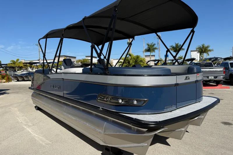 Slide: The Image of 2026 Avalon 2385 Catalina Quad Lounger Tri Toon boat with canopy in outdoor setting. - 4