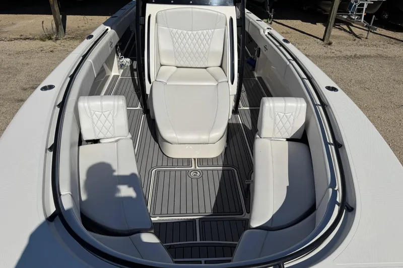 Slide: The Image of 2019 Fountain 34 Center Console boat with white seating and sleek design. - 9
