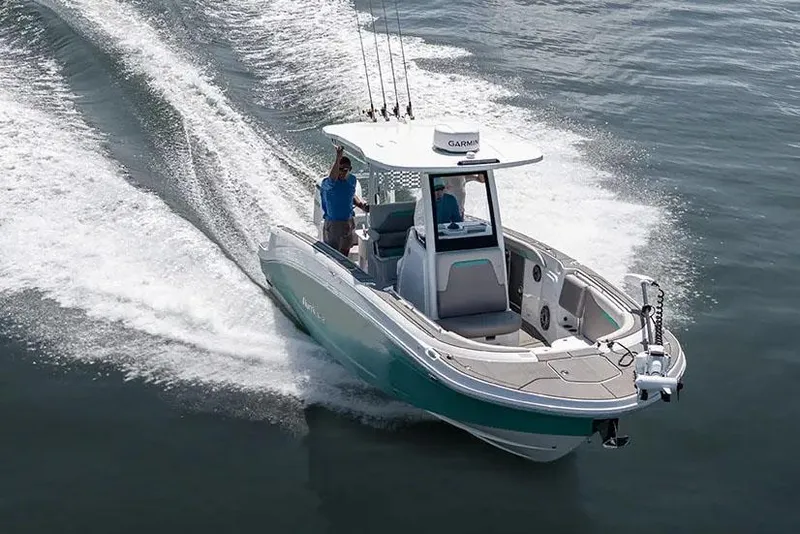 Slide: The Image of Manufacturer Provided Image: 2026 Hurricane Center Console 24 OB boat cruising on water, showcasing sleek design and performance. - 1