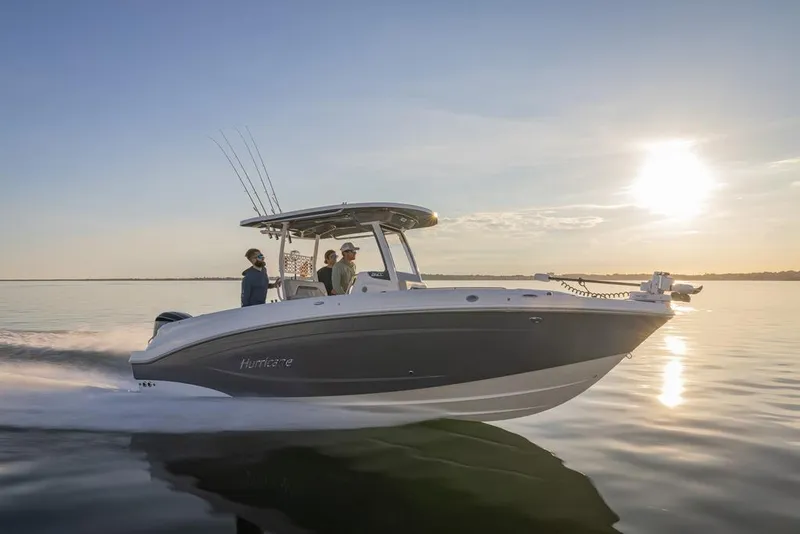 Slide: The Image of 2026 Hurricane Center Console 24 OB boat cruising at sunset on calm waters. - 20