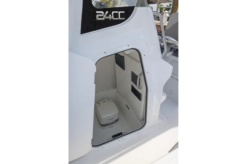 Slide: The Image of 2026 Hurricane Center Console 24 OB boat interior with compact toilet. - 9