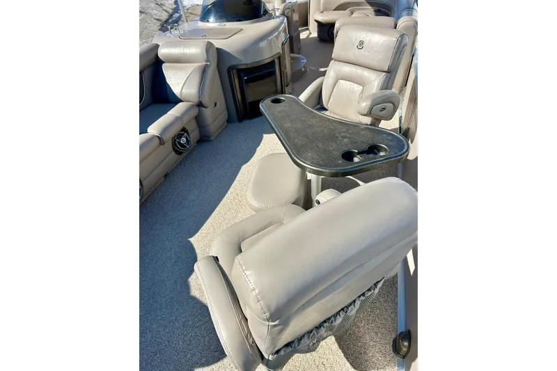 Slide: The Image of 2007 Premier 250 Intrigue boat interior with plush seating and a central table. - 10