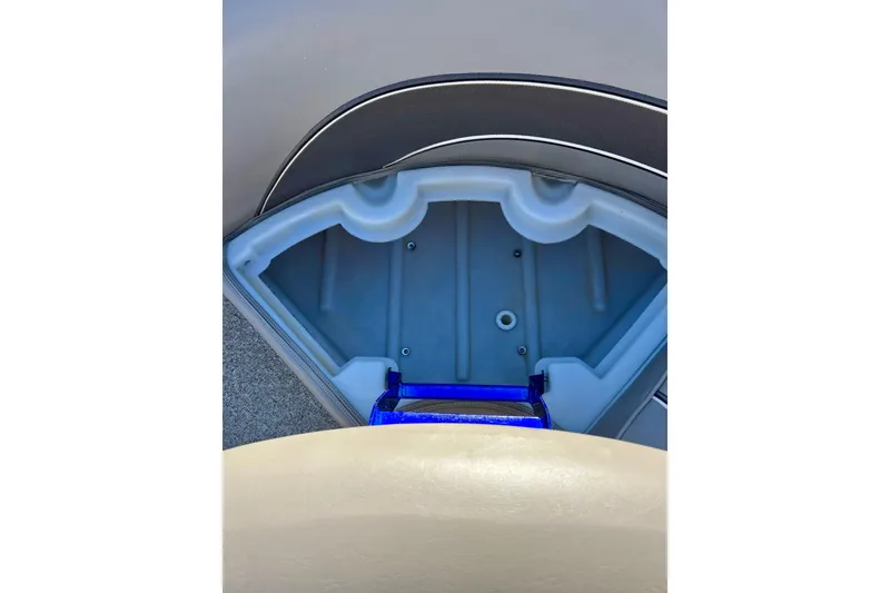 Slide: The Image of 2007 Premier 250 Intrigue boat interior storage compartment with blue accents. - 15