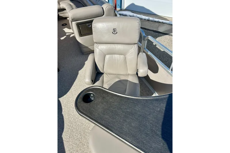 Slide: The Image of 2007 Premier 250 Intrigue boat interior with gray leather seating and table. - 21