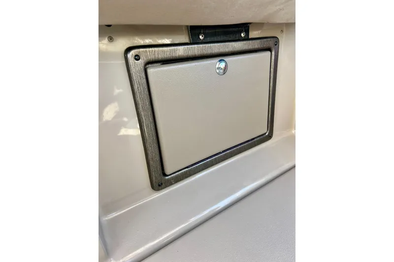 Slide: The Image of Storage compartment on 2007 Premier 250 Intrigue boat, featuring a secure lockable door. - 30