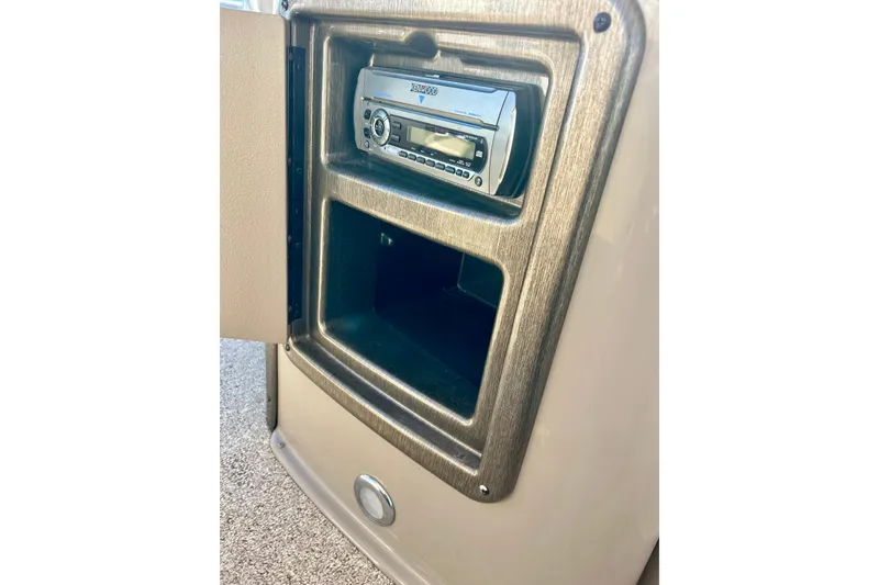 Slide: The Image of 2007 Premier 250 Intrigue stereo system with open storage compartment. - 32