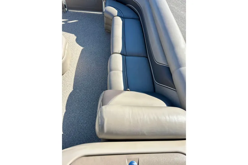 Slide: The Image of 2007 Premier 250 Intrigue boat interior with beige and blue seating. - 34