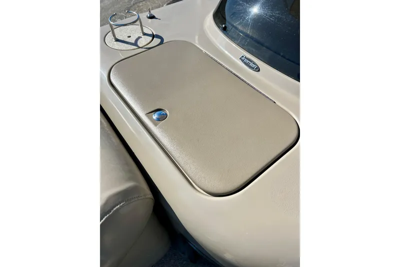 Slide: The Image of 2007 Premier 250 Intrigue boat dashboard with cup holder and storage compartment. - 35