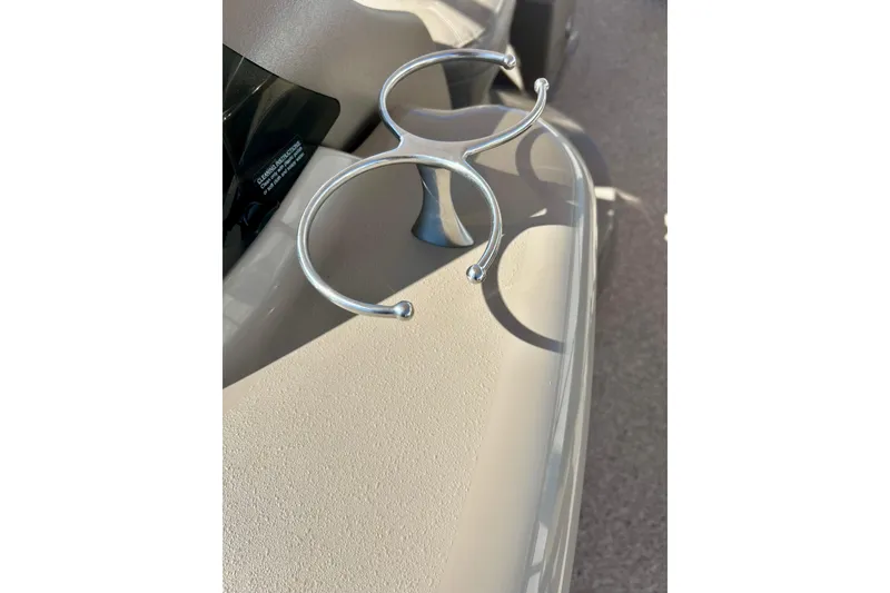Slide: The Image of Close-up of a 2007 Premier 250 Intrigue boat's cup holder on a beige surface. - 37
