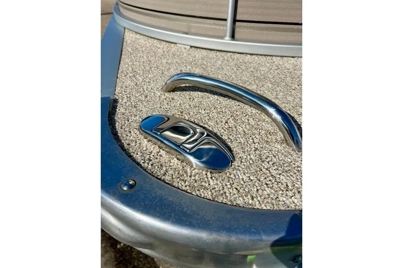 Slide: The Image of 2007 Premier 250 Intrigue boat deck with chrome details and textured flooring. - 40