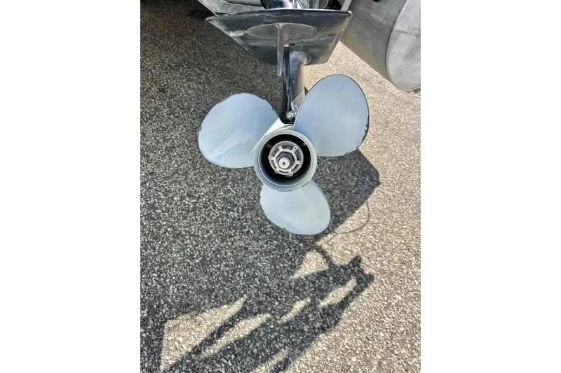 Slide: The Image of Propeller of 2007 Premier 250 Intrigue boat on asphalt surface. - 44