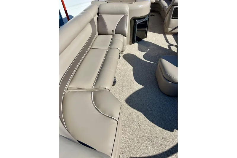 Slide: The Image of 2007 Premier 250 Intrigue boat interior with beige seating and carpeted floor. - 48