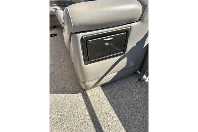 Slide: The Image of 2007 Premier 250 Intrigue boat interior with gray seating and storage compartment. - 49