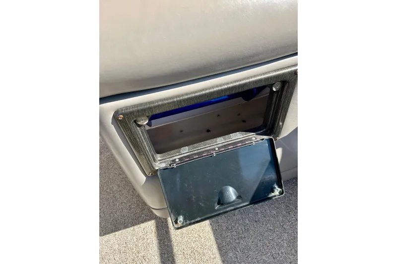 Slide: The Image of Open storage compartment on a 2007 Premier 250 Intrigue boat interior. - 50
