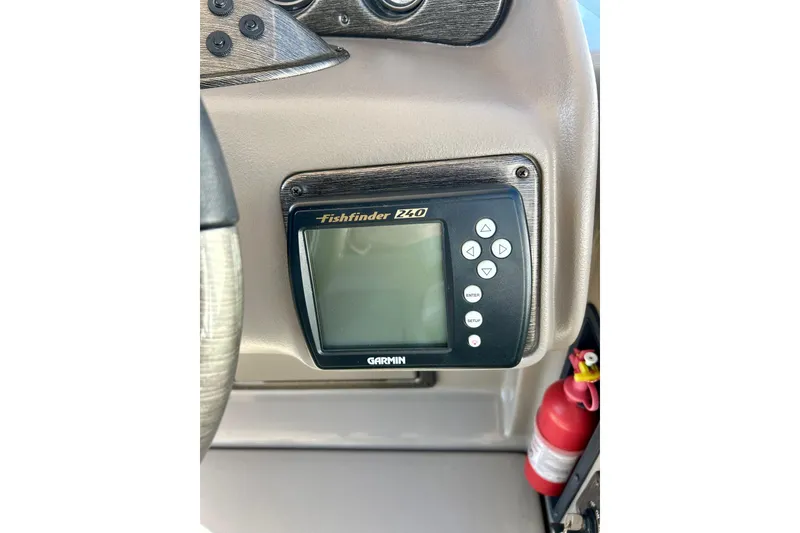Slide: The Image of Garmin Fishfinder 240 on 2007 Premier 250 Intrigue boat dashboard with fire extinguisher. - 53